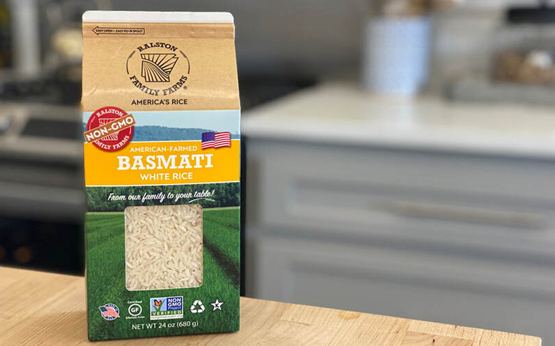 Basmati rice in carton sitting on table